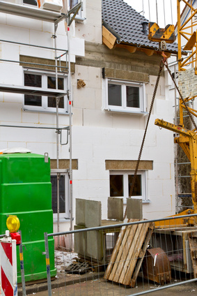Once Planning and Building Regulations approval is granted, the build can commence House during construction, outside view